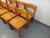 Eight vintage 1970s pine chairs by Ilmari Tapiovaara for Asko. Good overall condition, with some marks and patina. Height:...