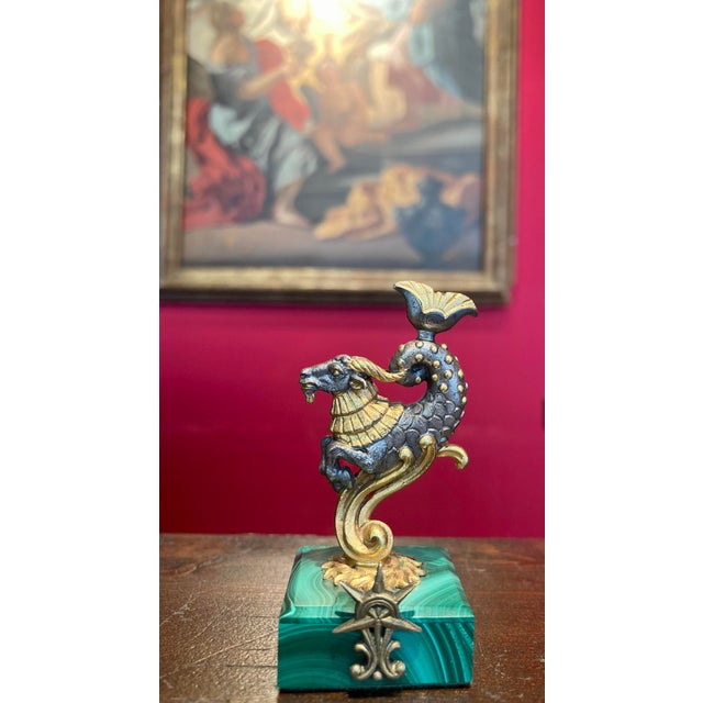 Refined set of four Italian mid-century zodiac place card holders crafted in gilt 800 silver and mounted on square...