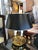 A gorgeous cast brass bouillotte style table lamp having ornate serpeants that hold up four candle arms with original...