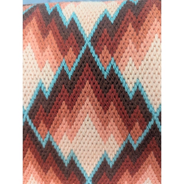 Vintage 1960s Needlepoint Decorative Pillow A Chevron pattern with hues of brick red, peach, brown, and turquoise blue...