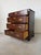 A timeless vintage Georgian Chippendale-style nightstand or bachelor’s chest, beautifully crafted from solid mahogany....