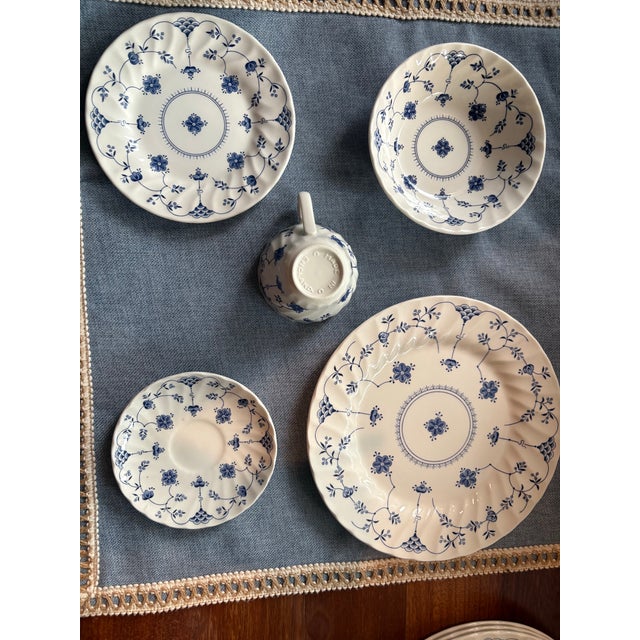 vintage service for four by Churchill Staffordshire, England. This set features the iconic "Finlandia" pattern: a crisp...