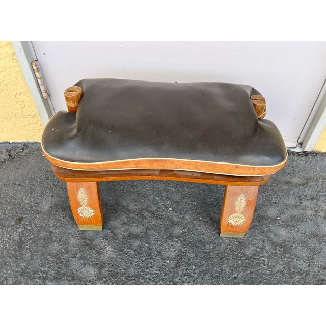 1960s, Mid Century Camel Stool / Ottoman . Has a black leather reversible cushion. Stuffed with old newspapers. The cotton...