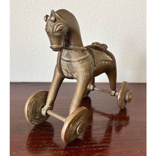 Antique Indian Bronze Temple Toy Horse-Drawn Chariot on Wheels, 19th Century A rare and evocative 19th-century Indian...