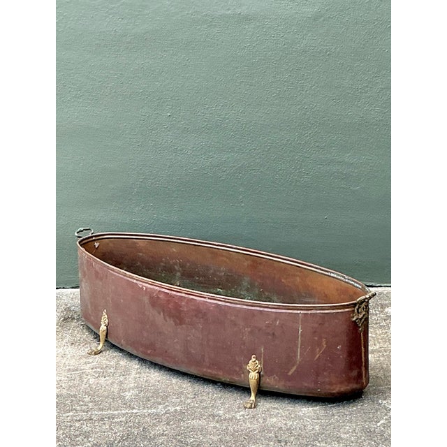 Make a grand statement in your home or garden with this spectacular pair of monumental vintage copper jardinières....