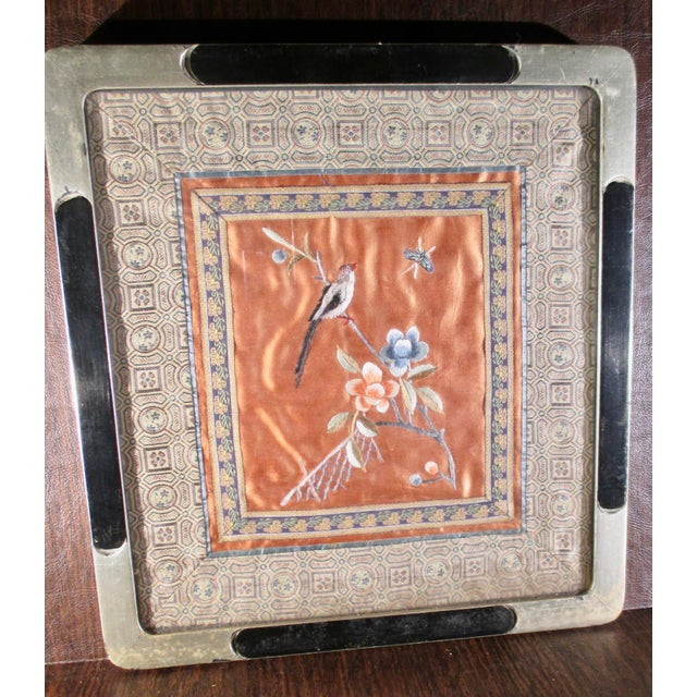 Embroidery panel of birds and flowers with fine Chinese brocades matting the panel. Colored in coppery colored silks and...