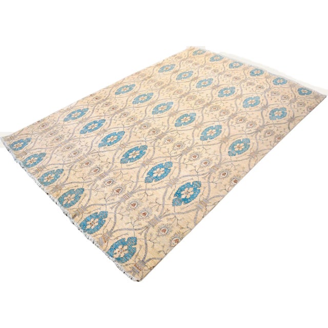 "Enhance the ambiance of your home with this magnificent Persian-influenced Turkish hand-knotted rug made by skilled...