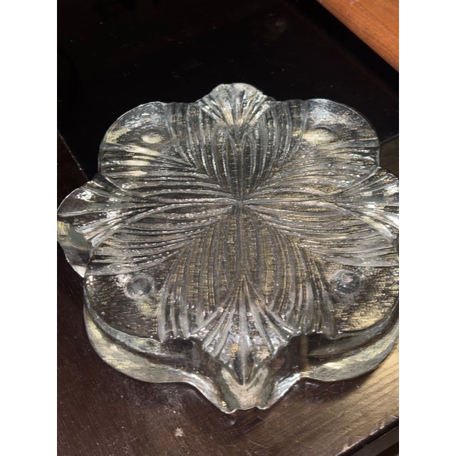 First I love this ashtray so much is its striking geometry. The “snowflake”or floral textured design plays beautifully...