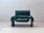 Striking ds-2011 leather armchair by de sede in an elegant petrol green. The design combines de sede's signature...