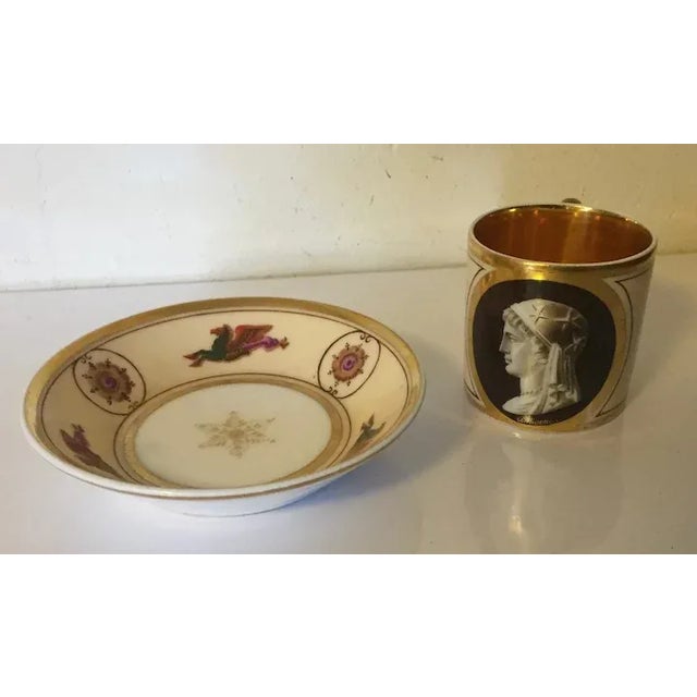 Antique early 19th century French Empire Paris porcelain coffee can and saucer by La Courtille. Decorated with a portrait...