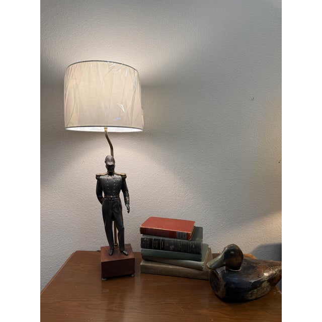 28” to top of shade. Lamp base is 5” x 5” This is a 9inch wide shade. X 7.5” tall . Metal figure mounted on a block of...