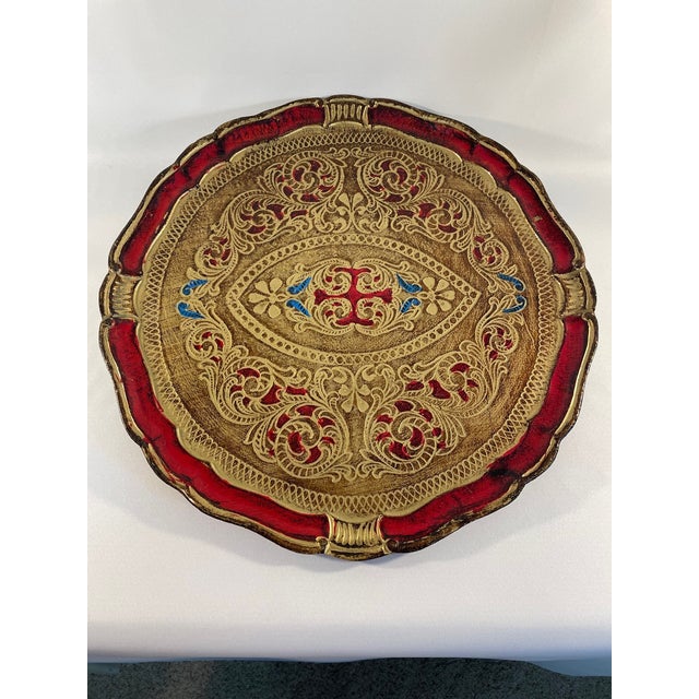 An elegant hand carved and hand painted large 17.25" diameter Italian Florentine Tray. Circa Mid 20th Century. This...