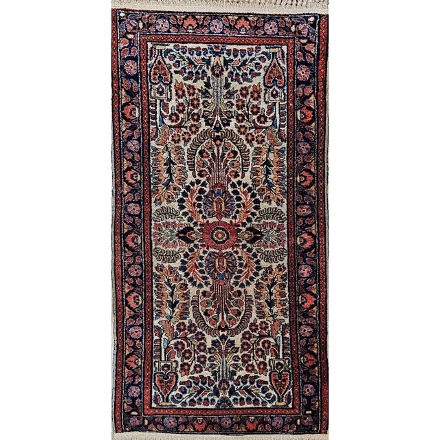 A rare vintage Persian ivory Sarouk rug from the second quarter of the 20th century — and the ivory ground is indeed the...