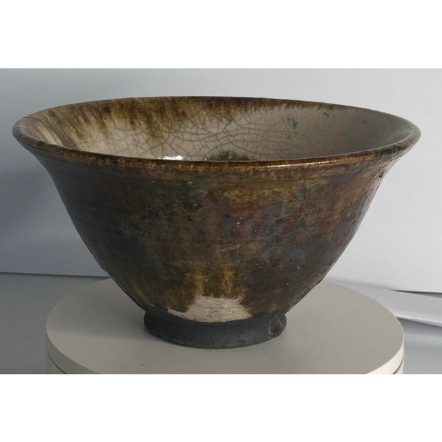 Art pottery phase signed Gail Jones Roku crackle glaze 8 1/4 inch diameter 4 1/2 inches high It has the pronounced flared...