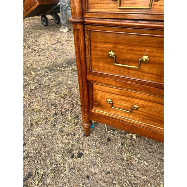 An elegant 19th-century French Louis XVI commode, crafted from solid walnut with beautifully figured walnut veneer. This...