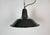 Industrial black enamel pendant light made in France during the 1960s. White enamel inside the shade. Metal top. The...