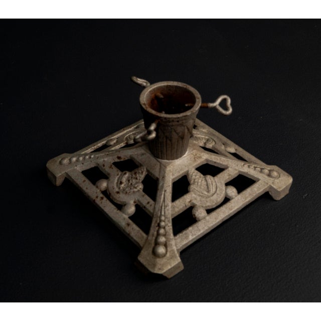 Art Nouveau Cast Iron Christmas Tree Stand, 1920s A robust Christmas tree stand from the 1920s, designed in the geometric...