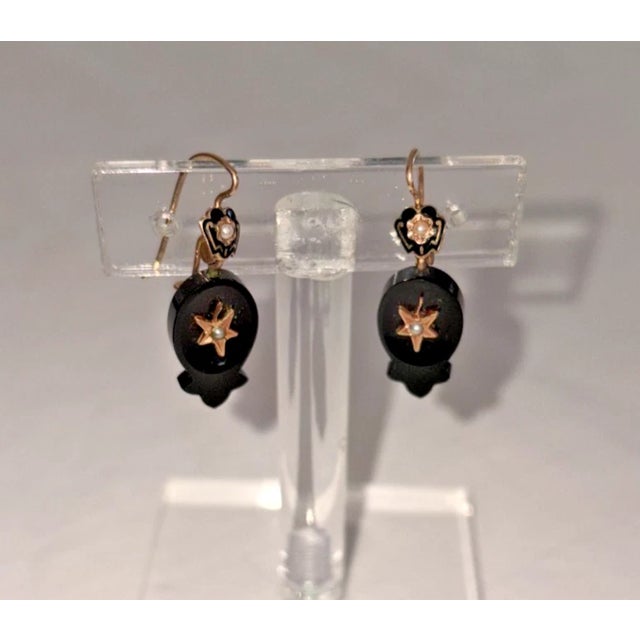 Victorian Rose Gold, Black Onyx, and Pearl Dangling Earrings A beautiful piece of Victorian Mourning jewelry, created for...