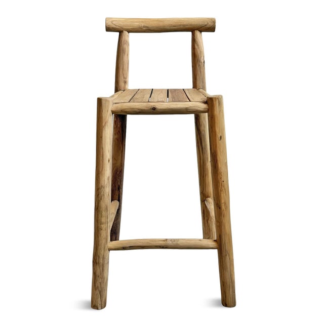 Natural raw sanded teak stick crafted bar stool. Each will vary slightly in natural coloring, wood grain, and inherent...