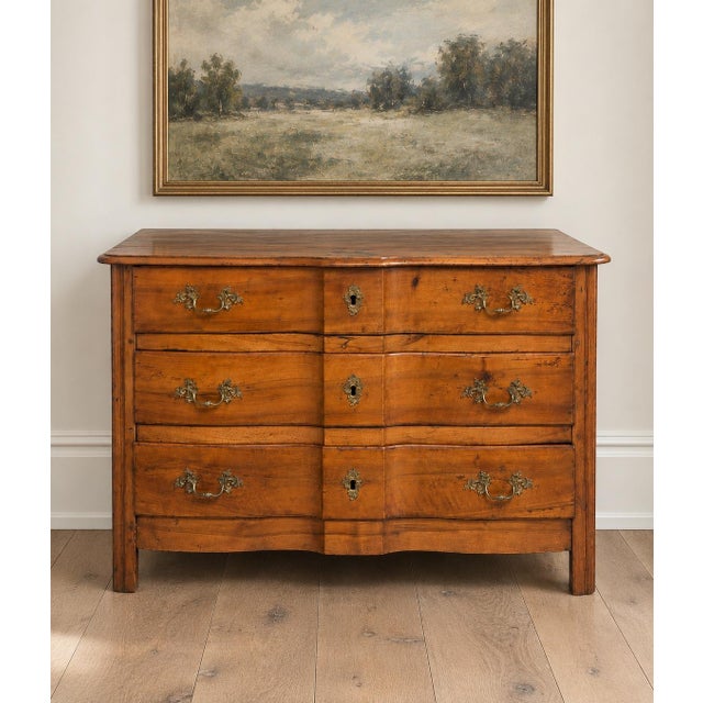 This exceptional 18th century French Louis XV provincial commode embodies the warmth, craftsmanship and understated...