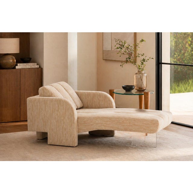 Vladimir Kagan “Deco” Chaise, designed in 1969, newly upholstered in a two-tone creamy linear fabric that highlights the...