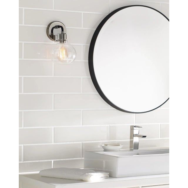 Clara features Clear Seeded glass shades that subtly diffuse the lamping while allowing the exposed bulb to be a central...