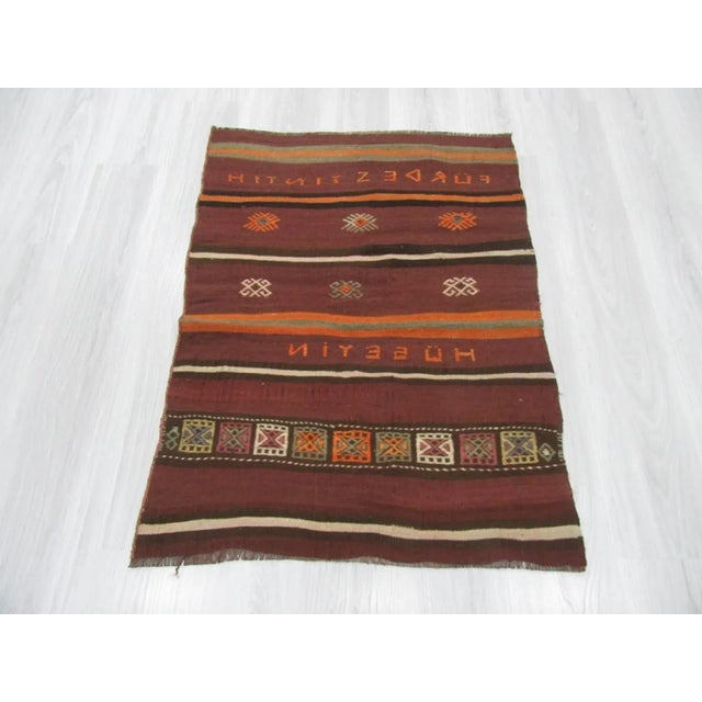 Embroidered vintage small kilim rug from Kars region of Turkey. Approximately 50-60 years old. In very good condition