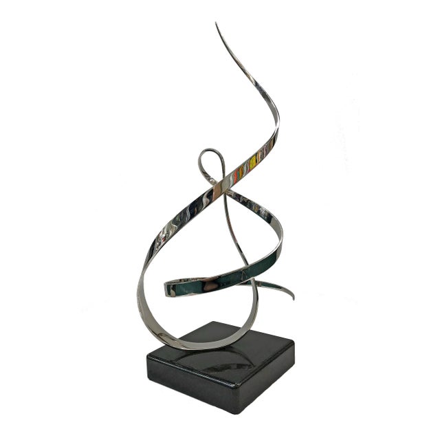 Kinetic stainless steel sculpture with marble base. Incised artist signature and date. Sculpture size: 29 x 12 x 9 inches...