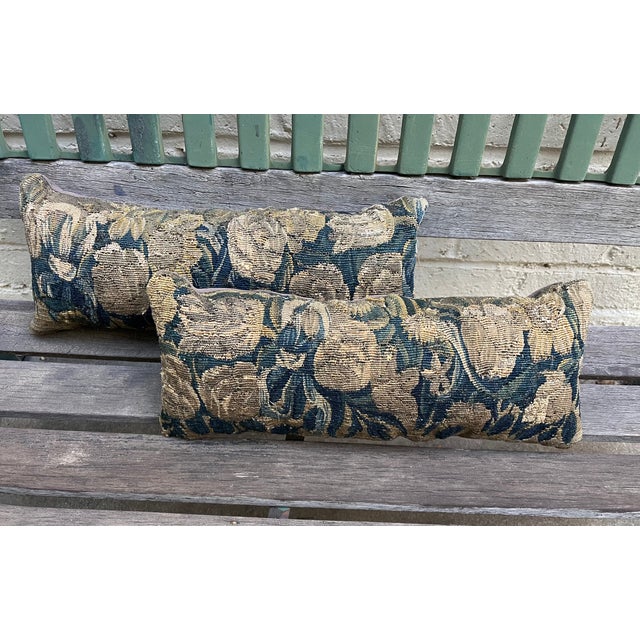 A beautiful pair of pillows upholstered in 18th-century verdure tapestry, featuring rich, timeless landscape-inspired...