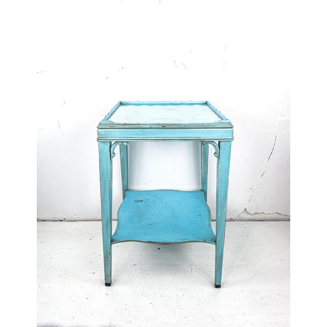 A sweetly refurbished side table in great condition, featuring a removable glass top and endless uses. We can picture it...