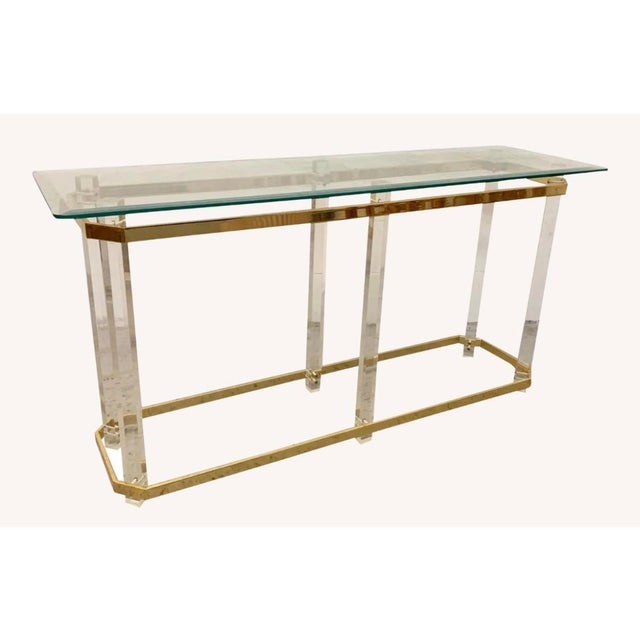Hollywood Regency console table featuring a distinctive design in the manner of Charles Hollis Jones, constructed with...