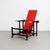 This striking Red Blue Chair, inspired by the renowned design of Gerrit Rietveld, is a stunning example of mid-century...