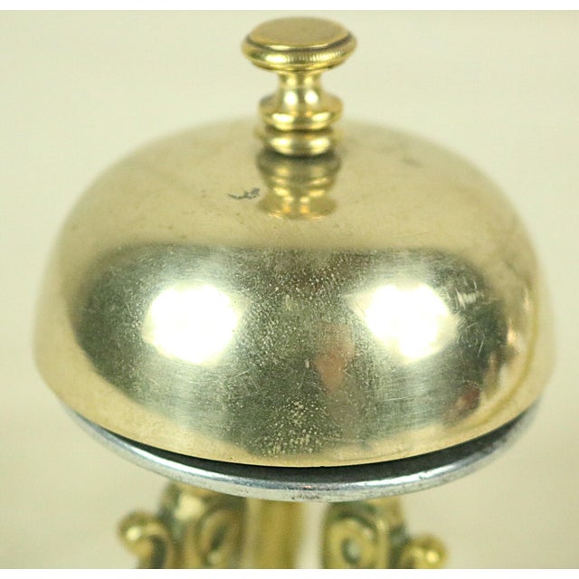 A very unusual English brass desk bell dating from the late 19th century. Most desk bells are rung either by depressing a...