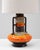 This 20th Century German orange fat lava ceramic table lamp is a striking example of mid-century West German design,...