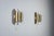 This pair of vintage wall lamps features an elegant brass design with a distinctive double-cylindrical shade. Each...