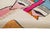 Bold and vibrant, this hand-knotted wool rug features abstract shapes in Fuchsia Pink, Teal Blue, Tangerine Orange, and...