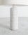 A very rare and iconic French mid century stoneware cylinder table lamp in a white glaze with a decorative pattern...
