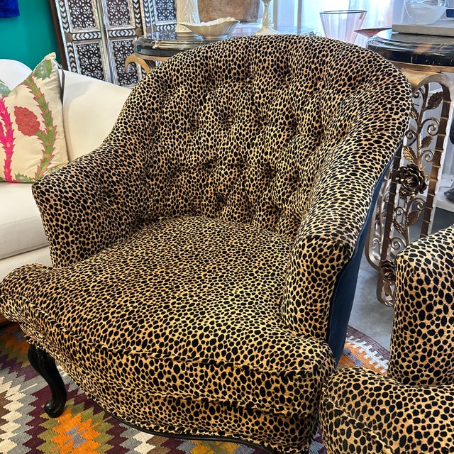 Pair of 1940s leopard print chairs. They have black painted wood frames and legs in French provencial style. Very...