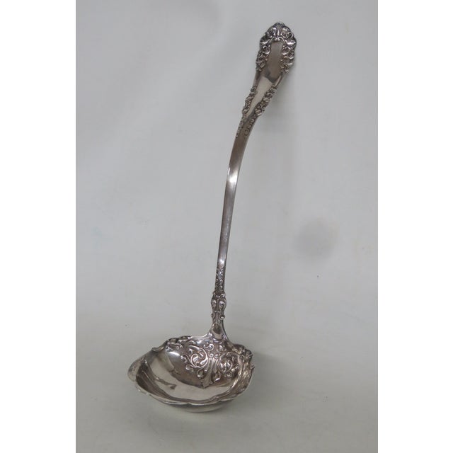 This gorgeous Soup / Punch Ladle is silver plated. The underside of the beautiful handle is stamped with the following...