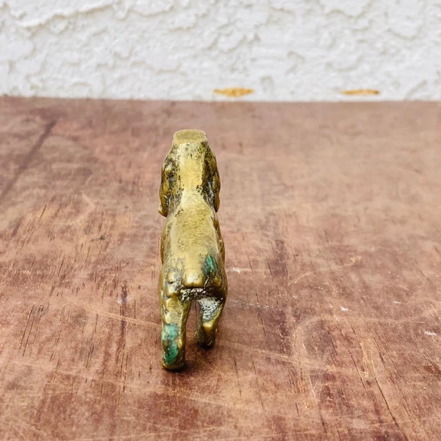 Made in England, this is a a very cute and classy brass Spaniel dog figure from the late 1800s. It will look just...