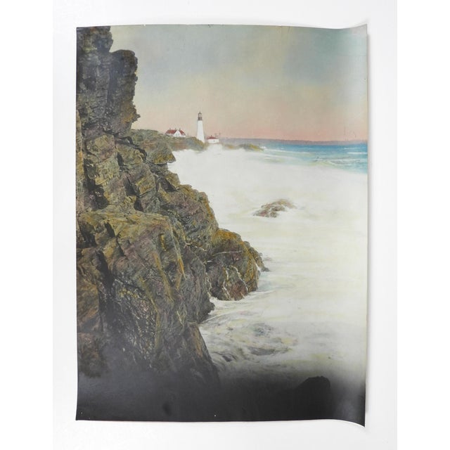 Early 20th century colortone advertising photograph of lighthouse on a rocky coast. Unsigned. Unframed, edge and corner wear.