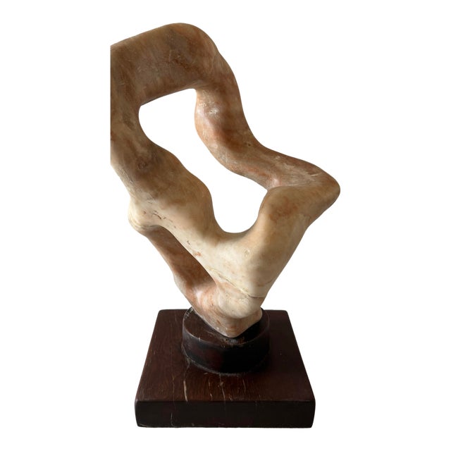 Large vintage stone (marble?) with organic flowing free form shape. Color is peach and orange with brown and white...