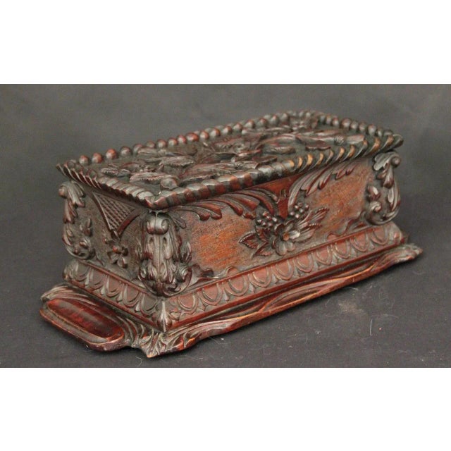 This is a 19th century carved mahogany box from circa 1880.