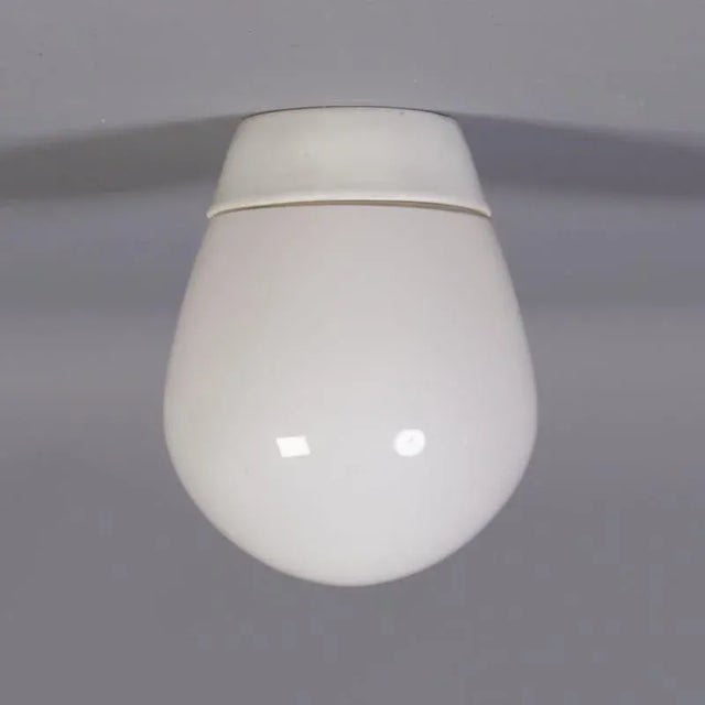 This ceiling lamp was designed in 1954 by Prof. Wilhelm Wagenfeld for the company Lindner, Bamberg, and made by Peil &...