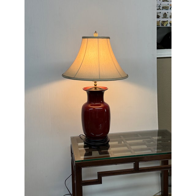 Design Plus Gallery presents an Asian Influenced Table Lamp with Oxblood Ceramic Urn Shape and Rosewood Base. The table...