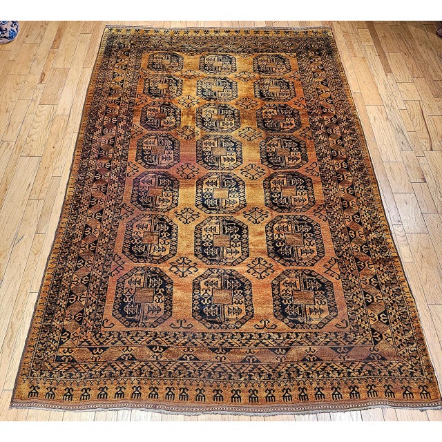 This authentic vintage Afghan Ersari room-size rug from the second quarter of the 20th century features a classic allover...