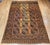 This authentic vintage Afghan Ersari room-size rug from the second quarter of the 20th century features a classic allover...