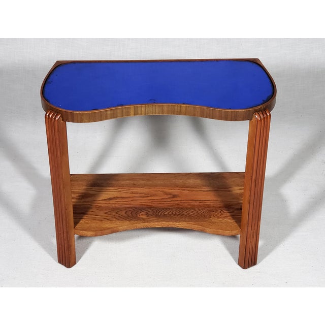 This item is a iconic vintage original Art Deco cobalt blue mirror glass kidney shaped side table. Evoking the era of the...