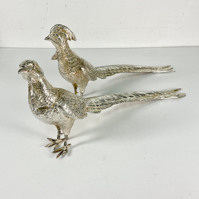 Vintage Home is pleased to present this pair of Italian Silverplated Game Bird Pheasant Figurals. They are an opposing...