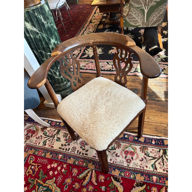 Handsome corner shaped roundabout desk chair having rich walnut frame with curved wooden backrest and carved splats,...